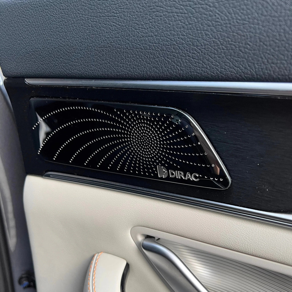 Black Dirac premium car door speaker grille with a sleek perforated metallic finish.