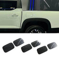 Set of six matte black textured door scuff plates for car protection.