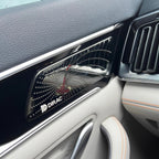 Black glossy Dirac premium car door speaker grille with metallic silver accents.