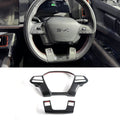Carbon fiber interior trim accessories with red accents for BYD steering wheel.