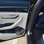 Premium white and navy blue BYD door panel featuring high-quality leather textures and Dirac speaker grilles.