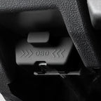 Close-up of a professional black plastic OBD port cover with embossed lettering.