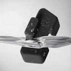Waterproof black silicone car accessory with a water splash, showcasing its durable material.