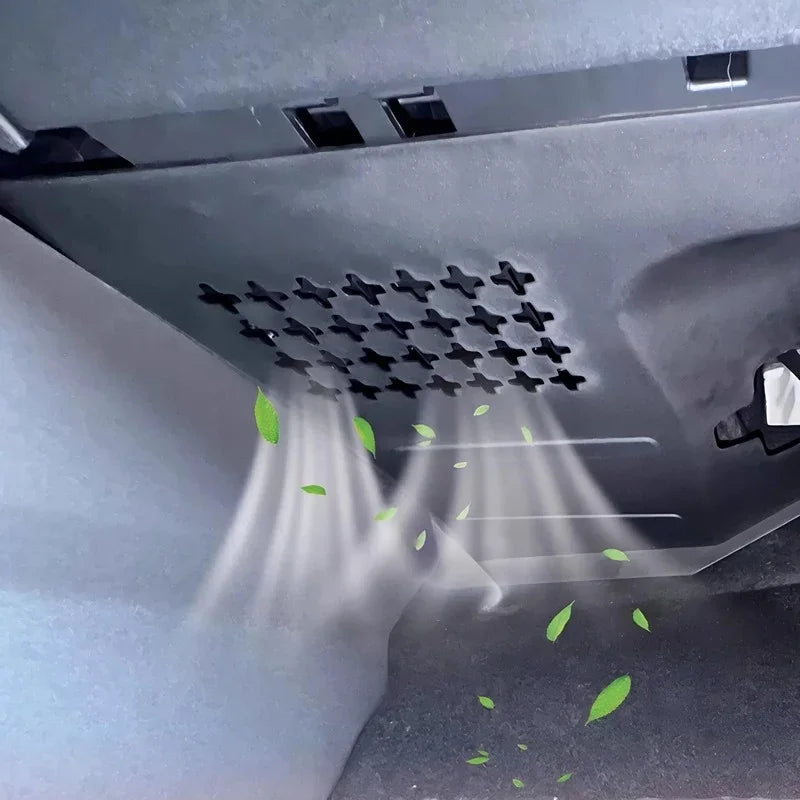 Black plastic car ventilation grill with air flow and leaf graphics for air purification.