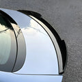 Glossy black aerodynamic rear spoiler installed on a silver BYD car trunk.