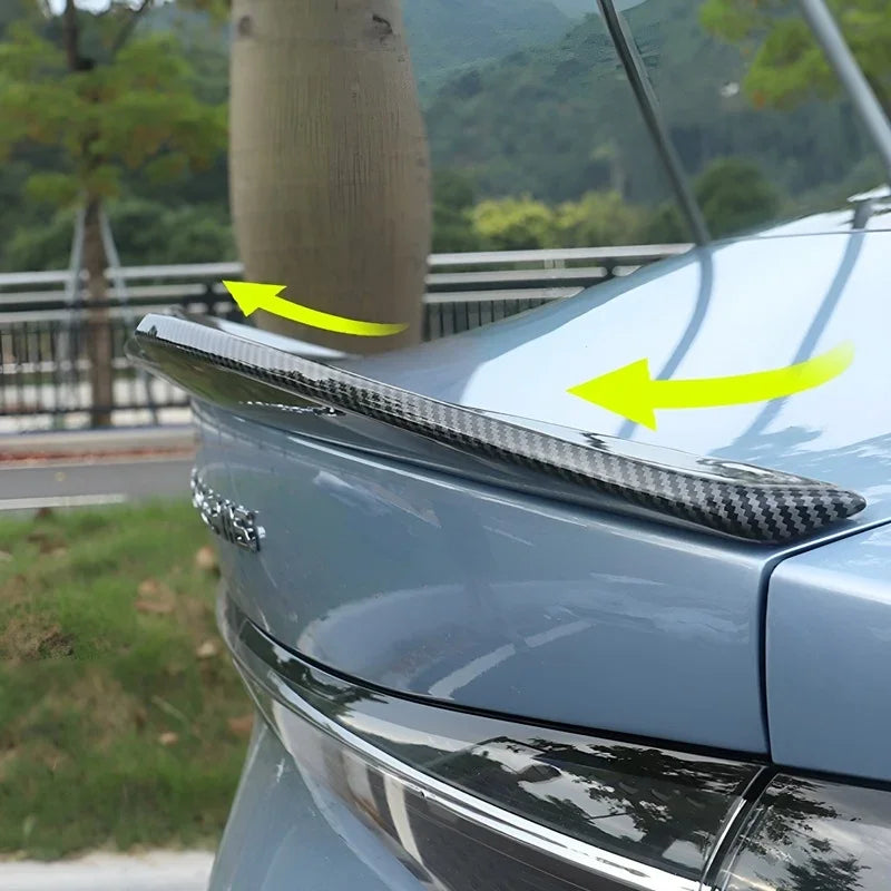Carbon fiber rear spoiler for BYD, featuring a sleek black textured finish for a sporty look.