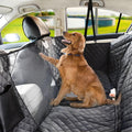 Golden Retriever in a car with a grey quilted waterproof pet seat cover and barrier.
