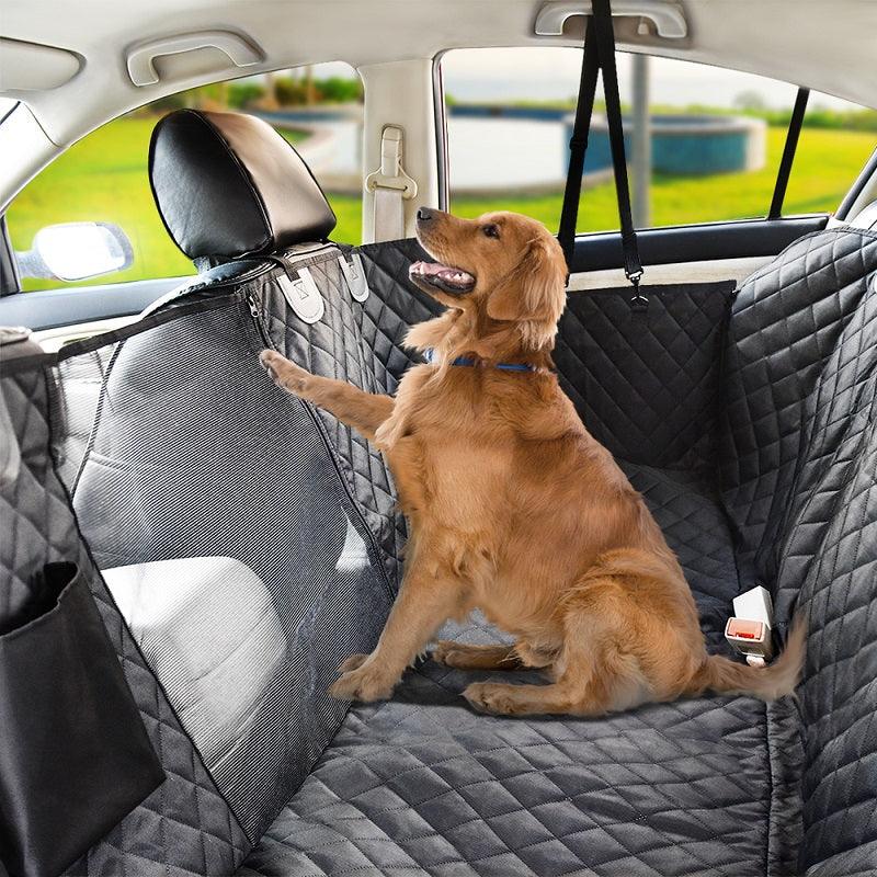 Golden Retriever in a car with a grey quilted waterproof pet seat cover and barrier.