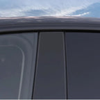 Sleek black tinted window deflectors installed on a car door for enhanced aerodynamics and style.