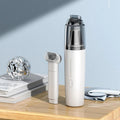Professional white portable vacuum cleaner with a transparent dust cup and an attachment tool.