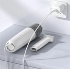 Professional white handheld cordless car vacuum cleaner with brush attachment and charging cable.