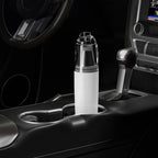 Sleek white and clear plastic car air purifier in a vehicle's center console cup holder.