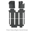 Black custom-fit rubber floor mats for right-hand drive vehicles with anti-slip texture.