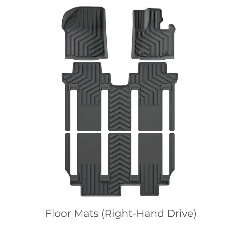 Black custom-fit rubber floor mats for right-hand drive vehicles with anti-slip texture.