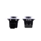Pair of durable black plastic automotive electrical switch components on a white background.