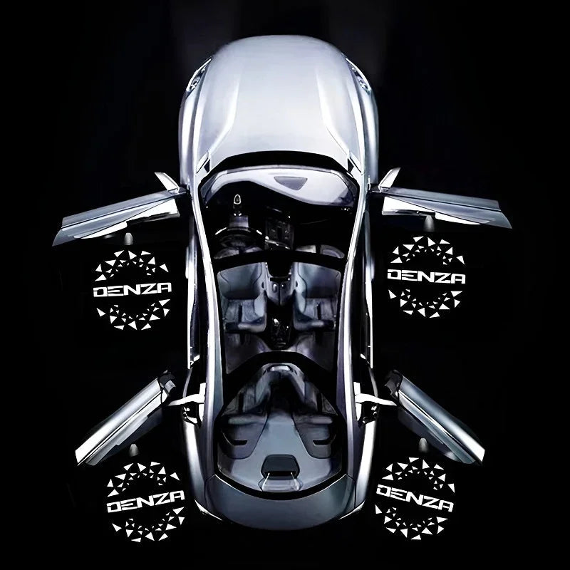 Top view of a silver Denza concept car with open gull-wing doors on a black background.