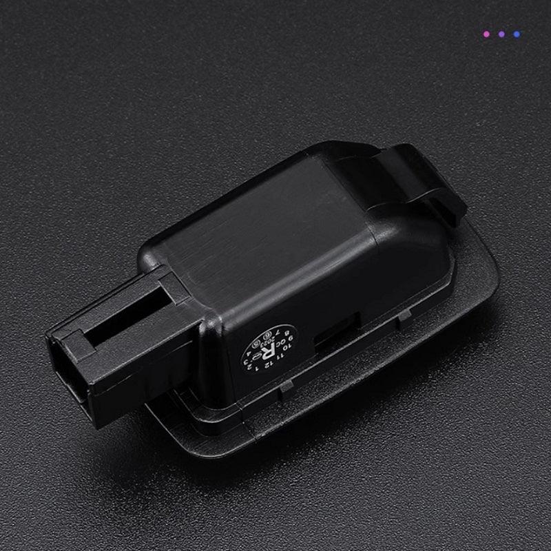 Black plastic automotive electrical connector with numbered terminal slots.