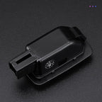 Black plastic automotive electrical connector with numbered terminal slots.