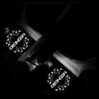 Denza branded white glowing decorative light panels on black car interior trim