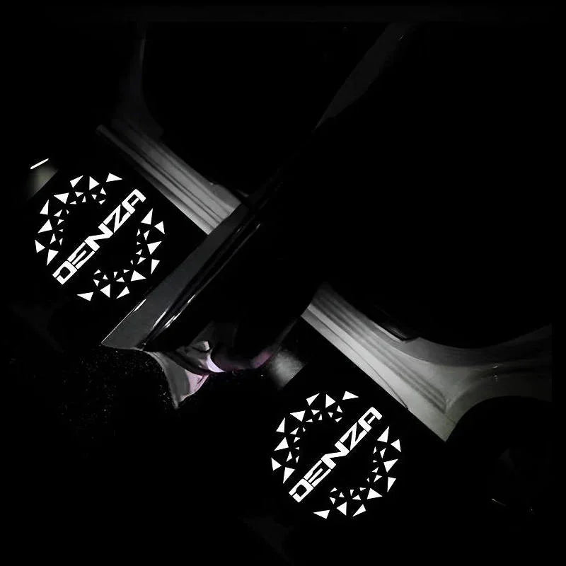 Denza branded white glowing decorative light panels on black car interior trim