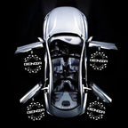 Top view of a futuristic silver Denza electric concept car with open doors and branded wheels.