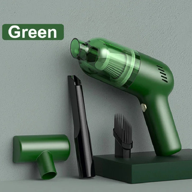 Green handheld portable vacuum cleaner with transparent plastic dust cup and black attachments.