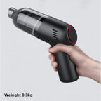 Handheld black cordless vacuum cleaner with transparent dust bin, lightweight 0.3kg design.