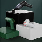 Set of three portable handheld car vacuum cleaners in black, forest green, and white matte finishes.