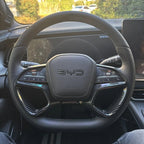 Black leather and carbon fiber steering wheel with BYD logo for premium car interior upgrade.