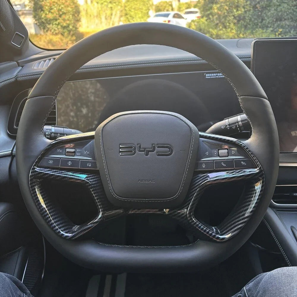 Black leather and carbon fiber steering wheel with BYD logo for premium car interior upgrade.