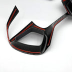 Black carbon fiber interior trim piece with striking red accent edges for BYD accessories.