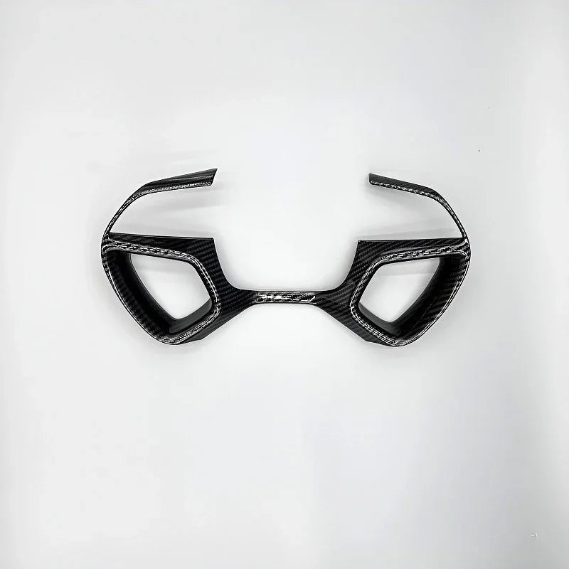 Black carbon fiber texture interior trim accessory for BYD car dashboard.