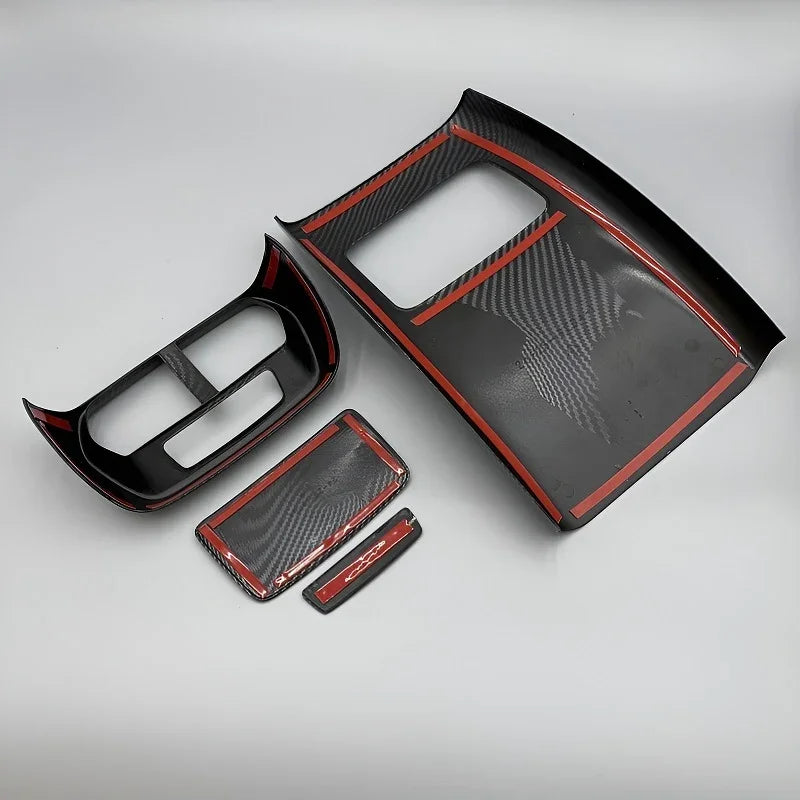 Black carbon fiber interior trim kit with distinctive red edge accents for BYD accessories.