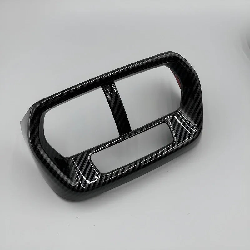 Glossy black carbon fiber patterned interior trim decorative frame for car dashboard.