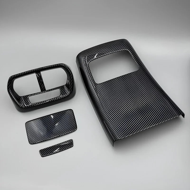 Black carbon fiber texture interior trim kit for car dashboard and console panels.