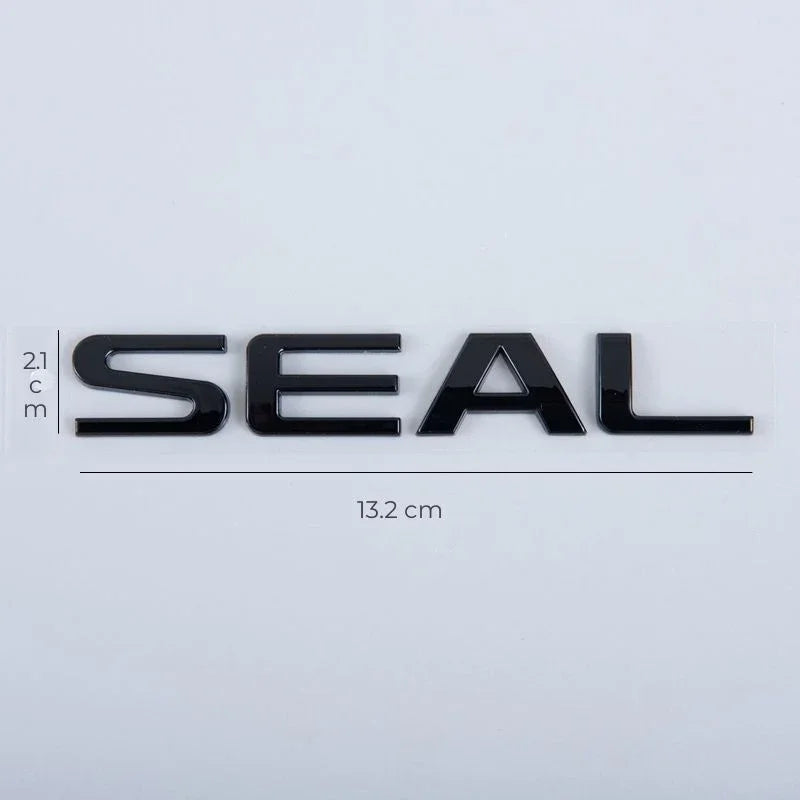 Glossy black SEAL emblem badge, 13.2 cm wide, premium metallic finish for car exterior.