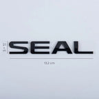 Glossy black SEAL emblem badge, 13.2 cm wide, premium metallic finish for car exterior.