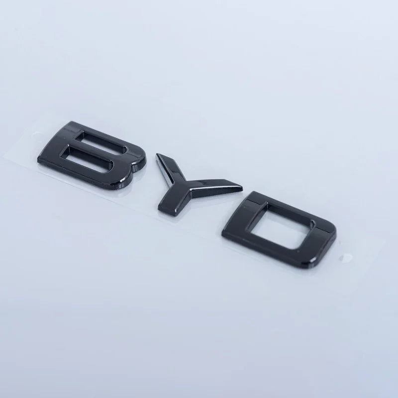 Glossy black BYD emblem lettering made of high-quality polished acrylic.