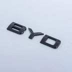 Glossy black BYD emblem lettering made of high-quality polished acrylic.