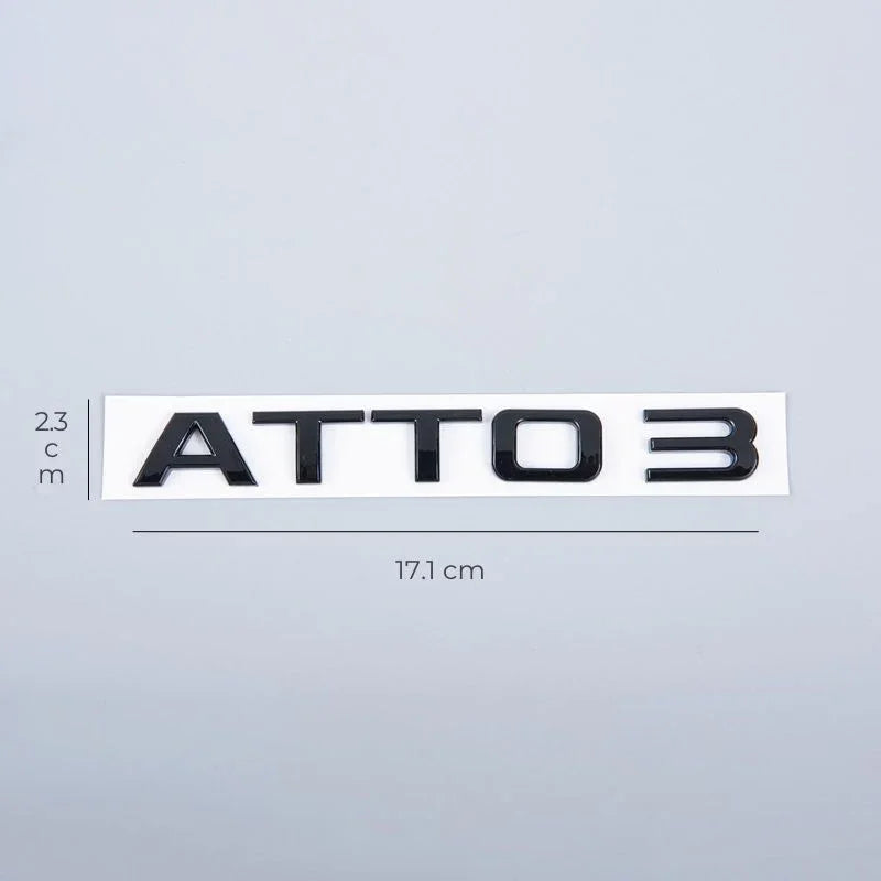 Glossy black ATTO 3 emblem badge, 17.1 cm wide, for premium car exterior styling.