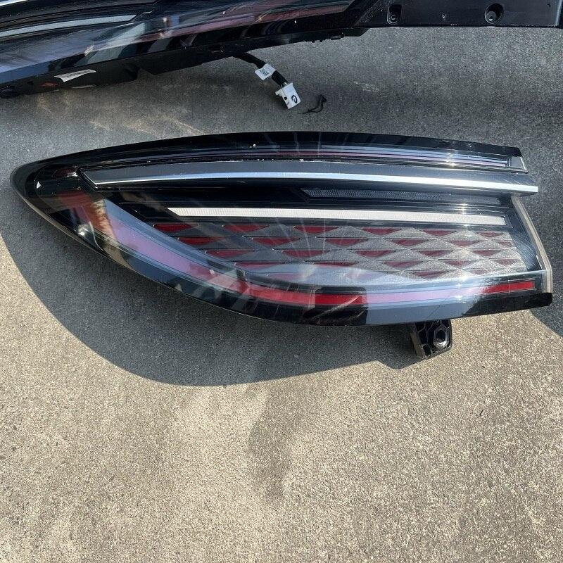 Sleek black tinted LED taillight with red accents and a diamond-patterned internal texture.