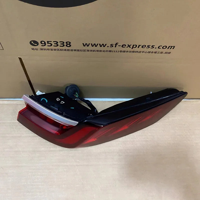 Professional red and clear plastic car tail light assembly with electrical wiring