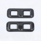 Two carbon fiber textured grey aftermarket car interior trim covers