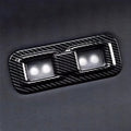 Black carbon fiber texture window switch panel for BYD vehicle interior.