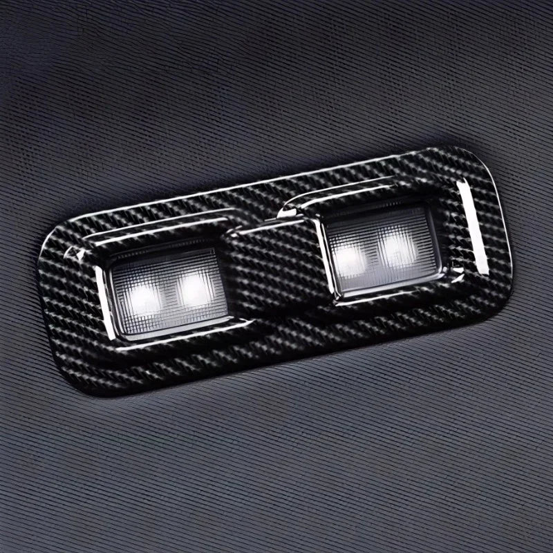 Black carbon fiber texture window switch panel for BYD vehicle interior.