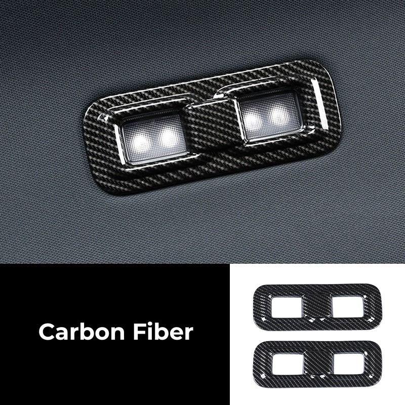 Black carbon fiber window switch trim covers for BYD car interior accessories.
