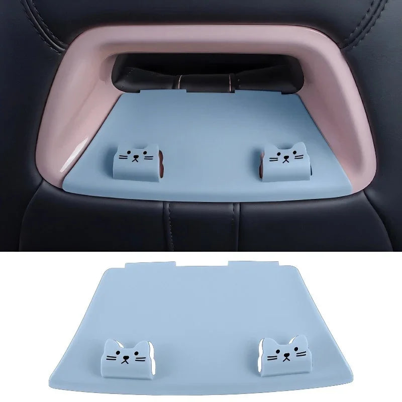Light blue silicone seat back tray with cute white cat decorations for car storage.