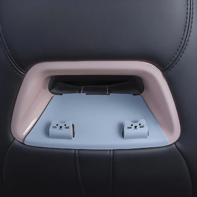 Light blue cat-themed silicone seatback organizer in a soft pink frame for car storage.