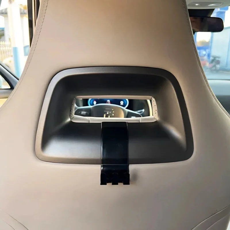 Premium beige leather car seat headrest with integrated black tablet holder mount.