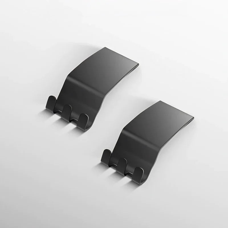 Pair of matte black metal car interior clips with a curved, durable design.